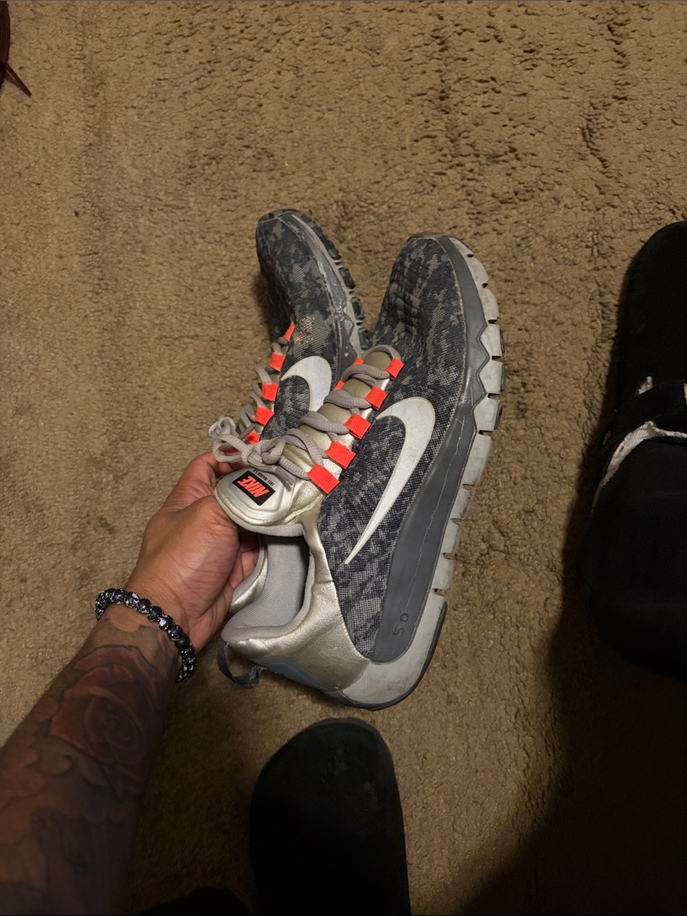 Nike Grey Camo Sneakers with White Swoosh and Orange Accents